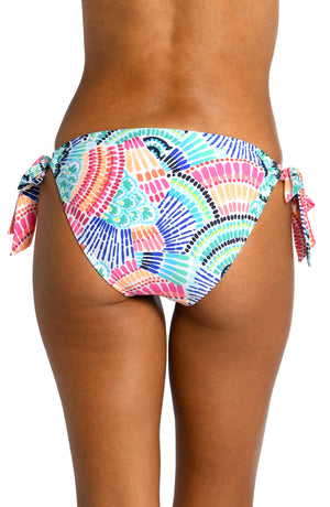 
            
                Load image into Gallery viewer, Model is wearing a multi colored geometric printed side tie hipster bottom from our Waves of Color collection!
            
        