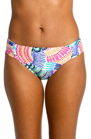 Model is wearing a multi colored geometric printed side shirred hipster bottom from our Waves of Color collection!