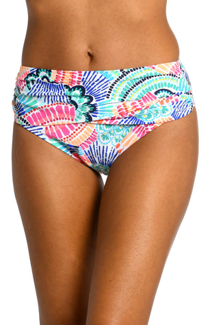 Model is wearing a multi colored geometric printed mid waist banded hipster bottom from our Waves of Color collection!