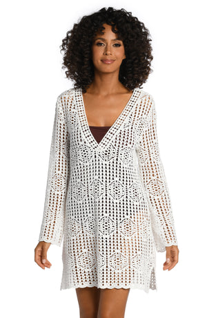 
            
                Load image into Gallery viewer, Model is wearing a solid ivory colored crochet v-neck dress cover up from our Waverly Covers collection.
            
        