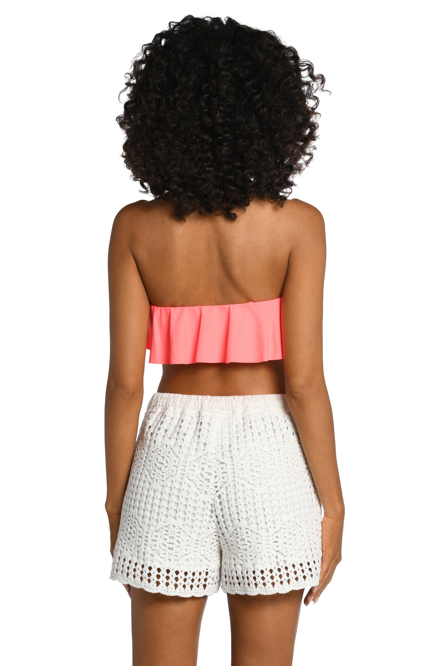 Model is wearing a solid ivory colored crochet beach shorts from our Waverly Covers collection.