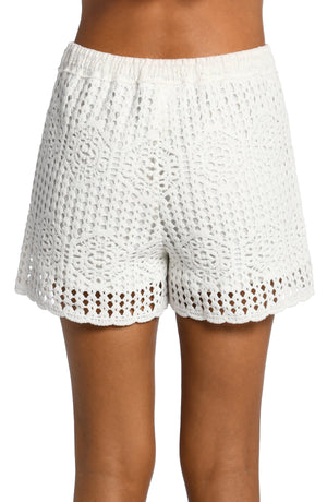 
            
                Load image into Gallery viewer, Model is wearing a solid ivory colored crochet beach shorts from our Waverly Covers collection.
            
        