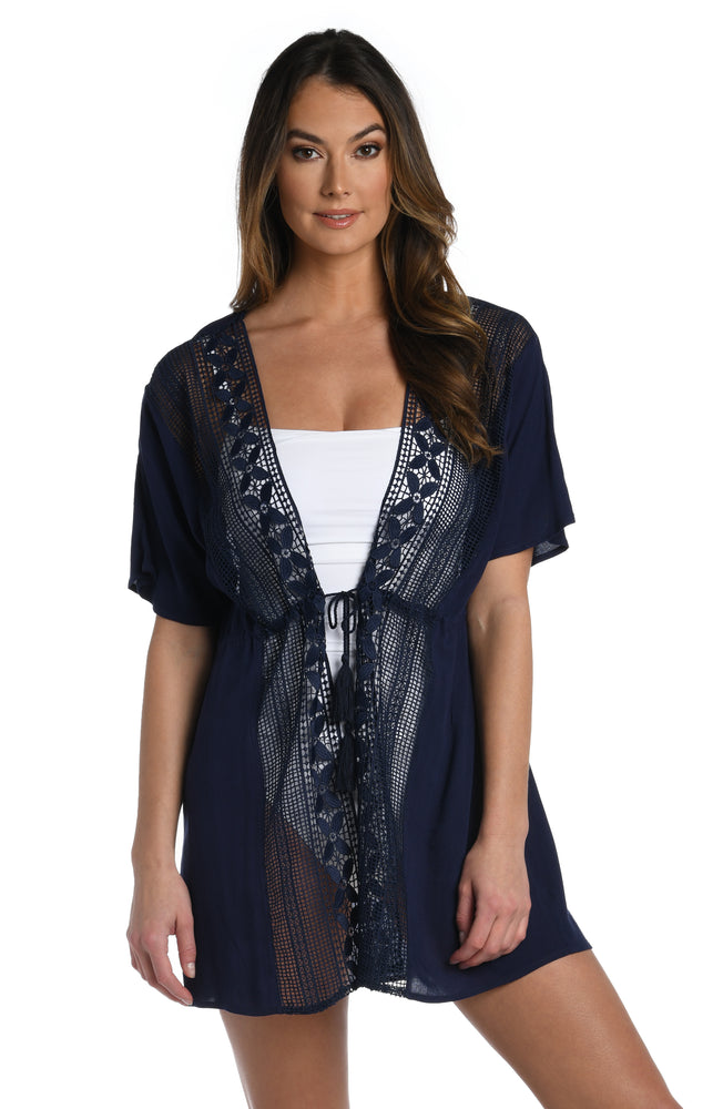 
            
                Load image into Gallery viewer, Model is wearing a crochet detailed pattern on this indigo kimono cover up from out Coastal Covers collection!
            
        