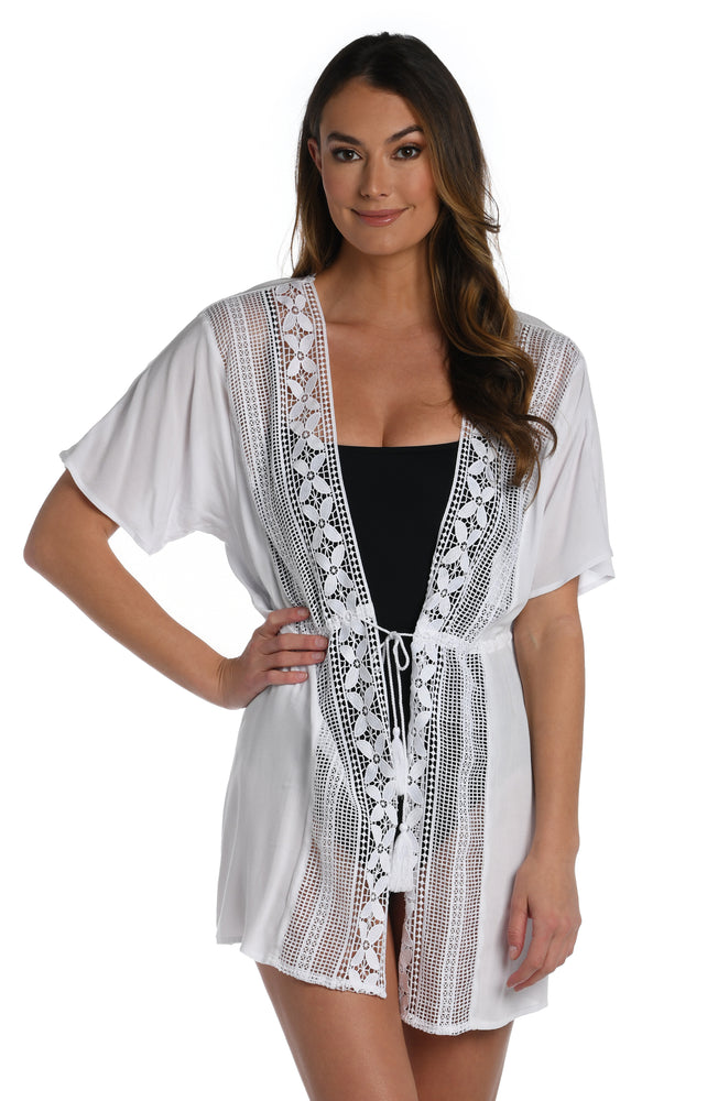 
            
                Load image into Gallery viewer, Model is wearing a crochet detailed pattern on this white kimono cover up from out Coastal Covers collection!
            
        