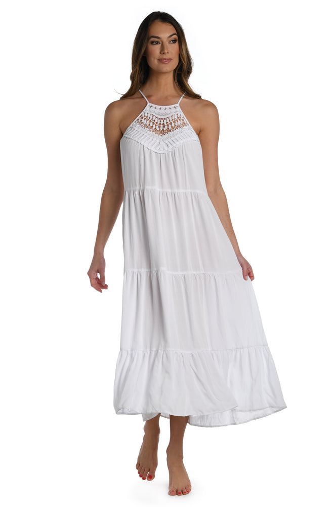 
            
                Load image into Gallery viewer, Model is wearing a crochet detailed pattern on this white halter midi dress cover up from out Coastal Covers collection!
            
        