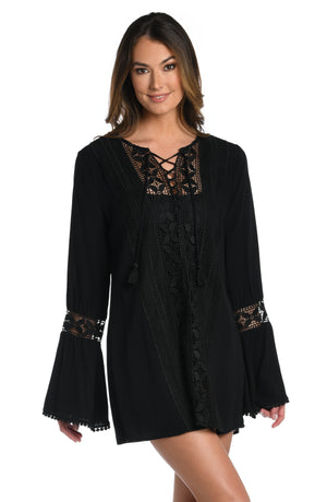 
            
                Load image into Gallery viewer, Model is wearing a crochet detailed pattern on this white v-neck tunic cover up from out Coastal Covers collection!
            
        