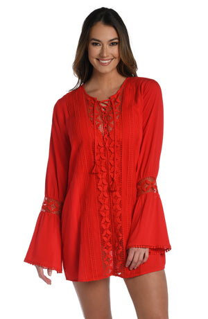Model is wearing a crochet detailed pattern on this cherry colored v-neck tunic cover up from out Coastal Covers collection!