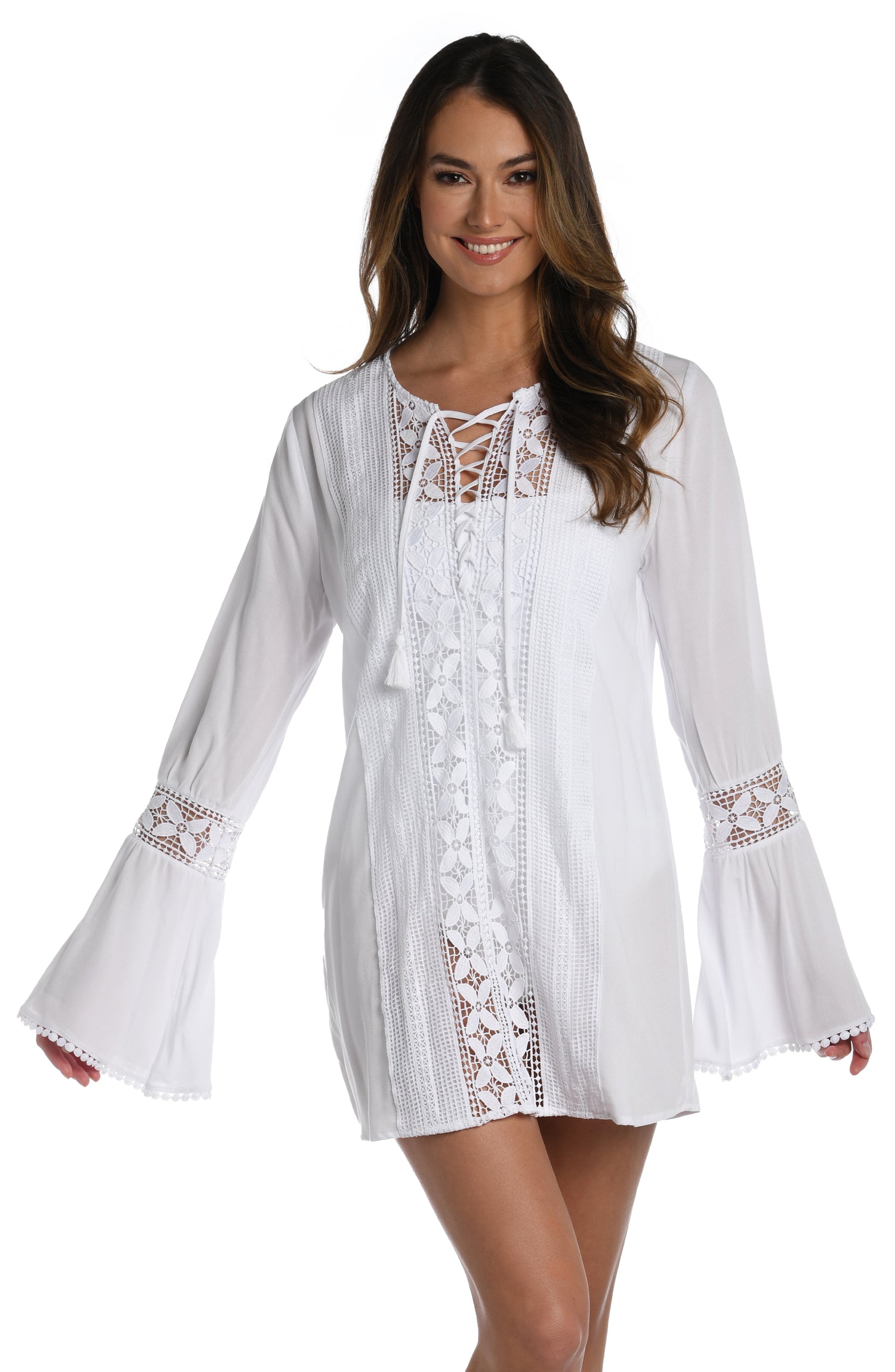Model is wearing a crochet detailed pattern on this white v-neck tunic cover up from out Coastal Covers collection!