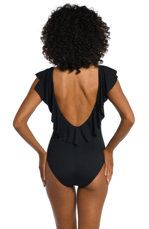 
            
                Load image into Gallery viewer, Model is wearing a black one piece swimsuit from our Best-Selling Island Goddess collection.
            
        