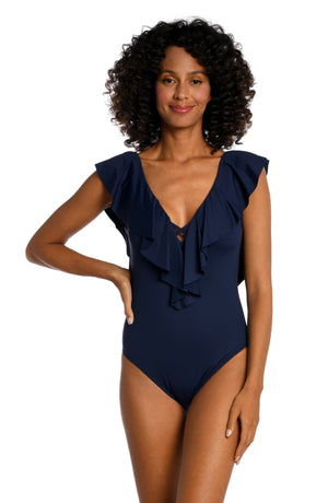 Model is wearing a indigo colored one piece swimsuit from our Best-Selling Island Goddess collection.