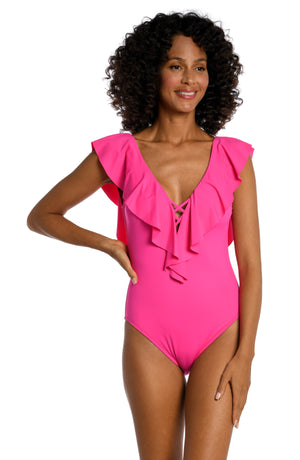 Model is wearing a pop pink colored one piece swimsuit from our Best-Selling Island Goddess collection.