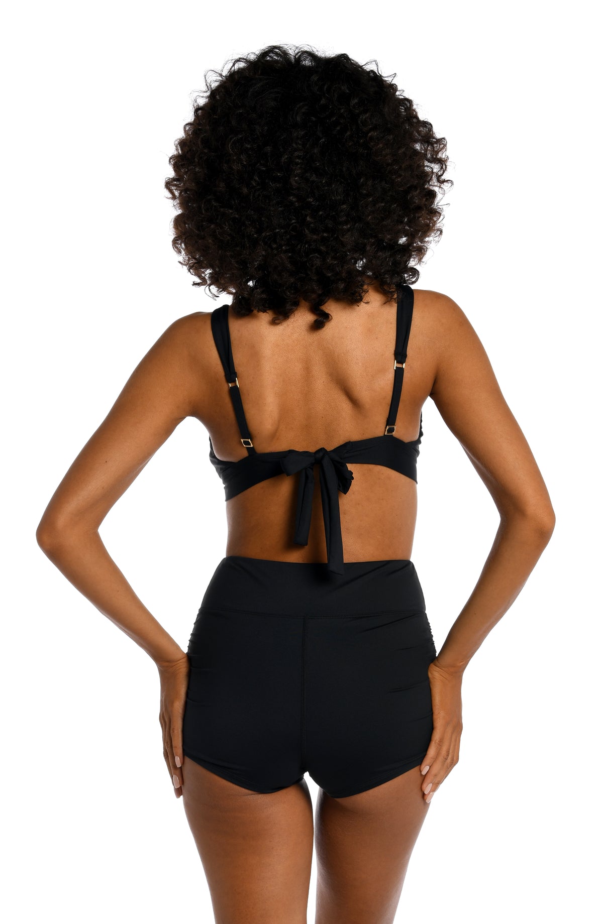 Model is wearing a black surf short swimsuit bottoms from our Best-Selling Island Goddess collection.