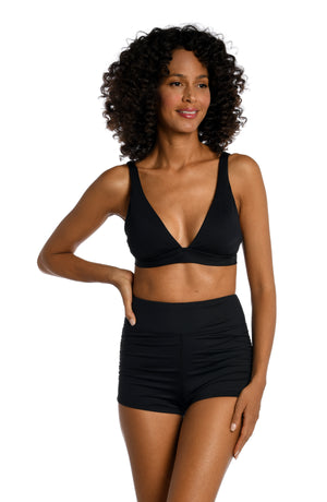 Model is wearing a black surf short swimsuit bottoms from our Best-Selling Island Goddess collection.