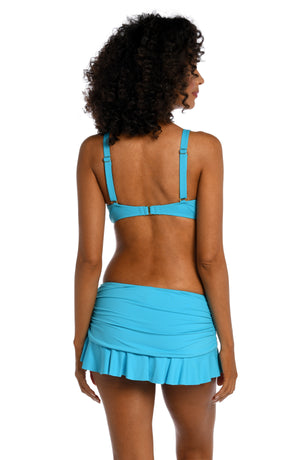 
            
                Load image into Gallery viewer, Model is wearing a azul (light blue) colored underwire swimsuit top from our Best-Selling Island Goddess collection.
            
        