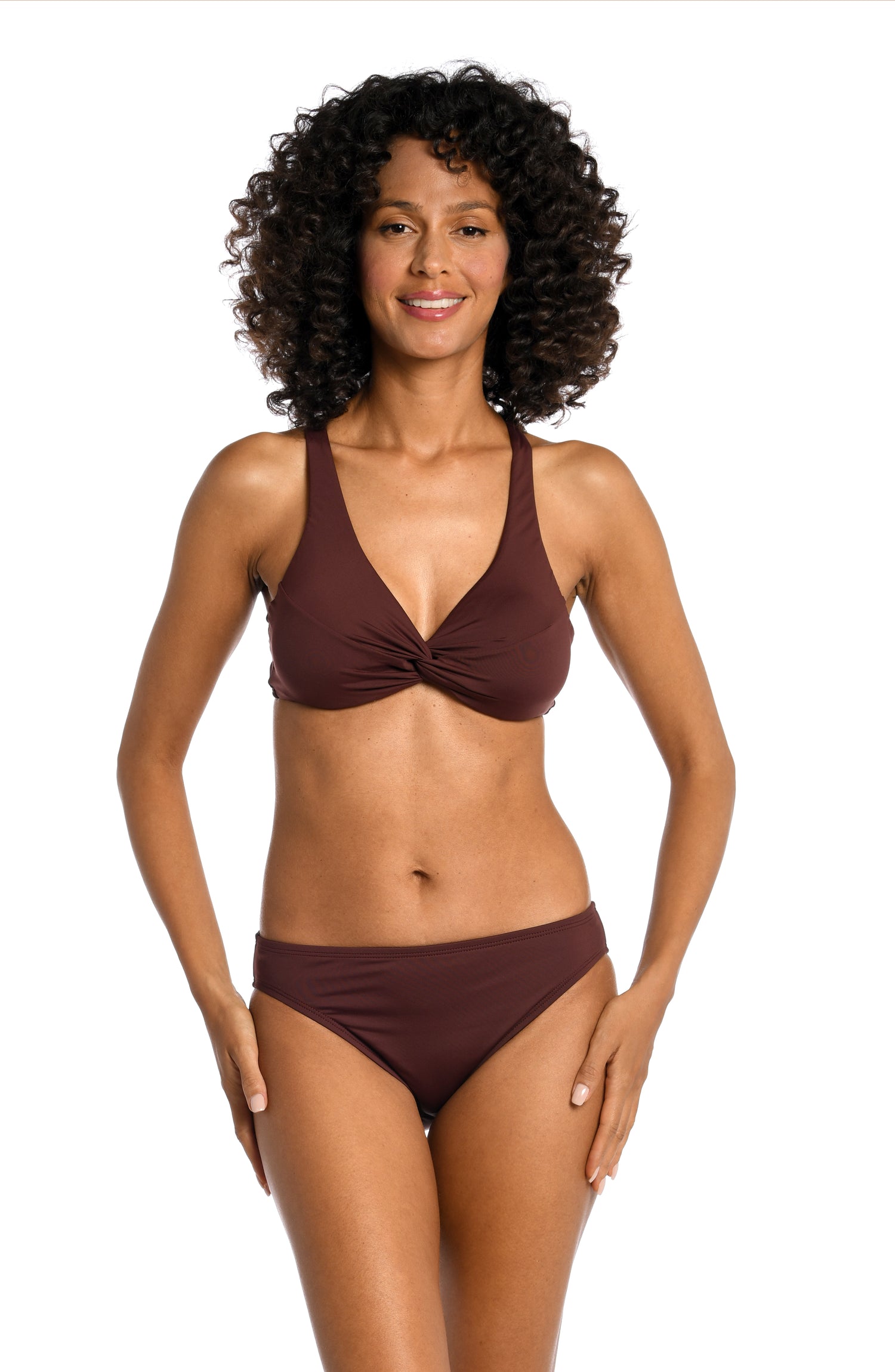 Model is wearing a solid brown colored twist front underwire bikini top from our Best-Selling Island Goddess collection.
