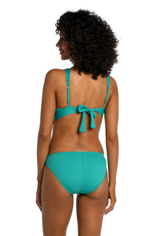 
            
                Load image into Gallery viewer, Model is wearing a emerald colored tall triangle swimsuit top from our Best-Selling Island Goddess collection.
            
        