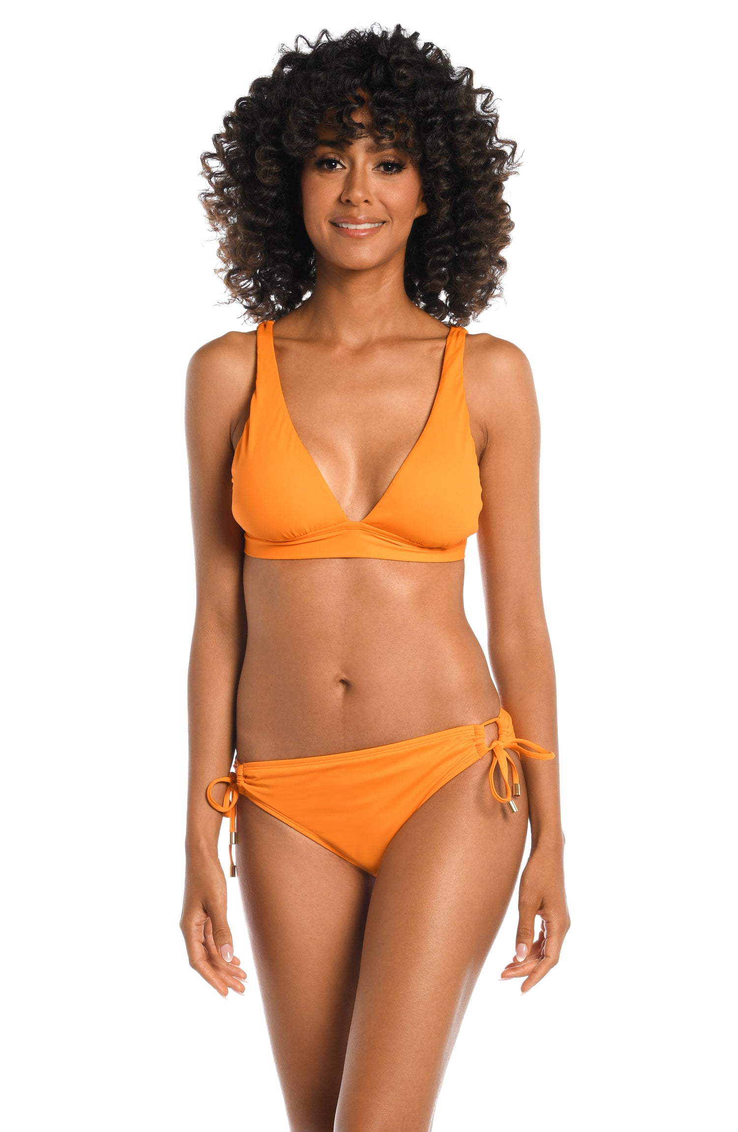 Model is wearing a tangerine colored over the shoulder swimsuit top from our Best-Selling Island Goddess collection.