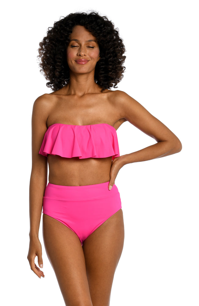 
            
                Load image into Gallery viewer, Model is wearing a pop pink colored ruffle bandeau swimsuit top from our Best-Selling Island Goddess collection.
            
        