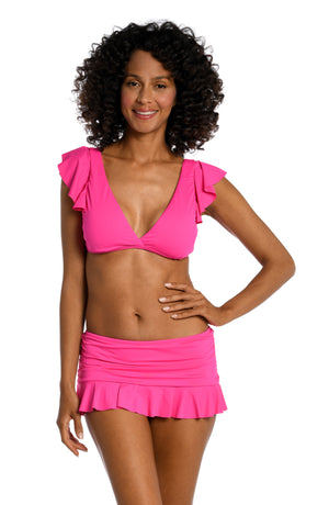 
            
                Load image into Gallery viewer, Model is wearing a pop pink colored ruffle sleeve swimsuit top from our Best-Selling Island Goddess collection.
            
        
