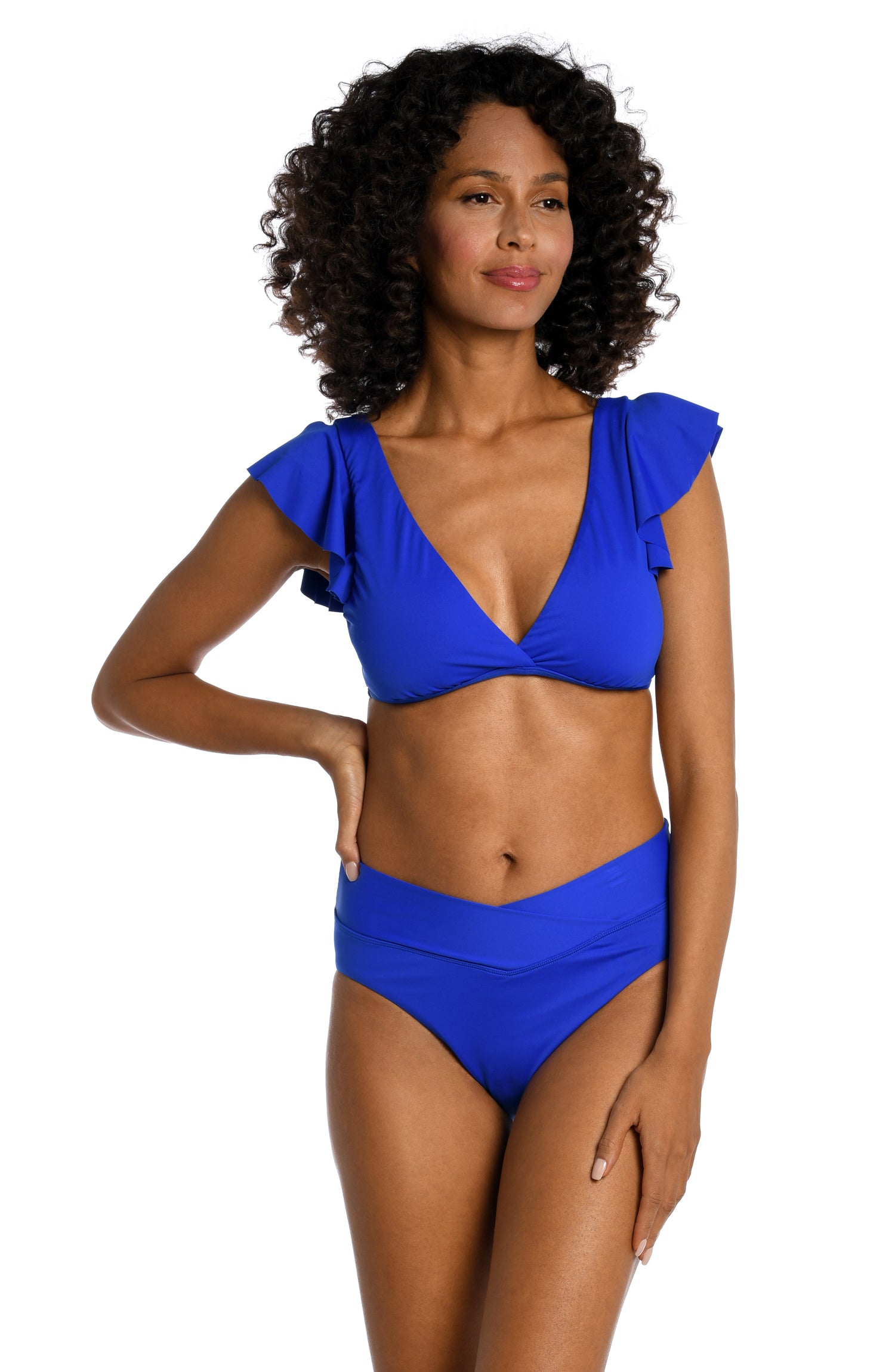 Model is wearing a sapphire colored ruffle sleeve swimsuit top from our Best-Selling Island Goddess collection.