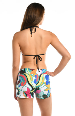 
            
                Load image into Gallery viewer, Model is wearing a multicolored bold floral printed 3&amp;quot; inseam board short bottom from our Sun Catcher collection. 
            
        