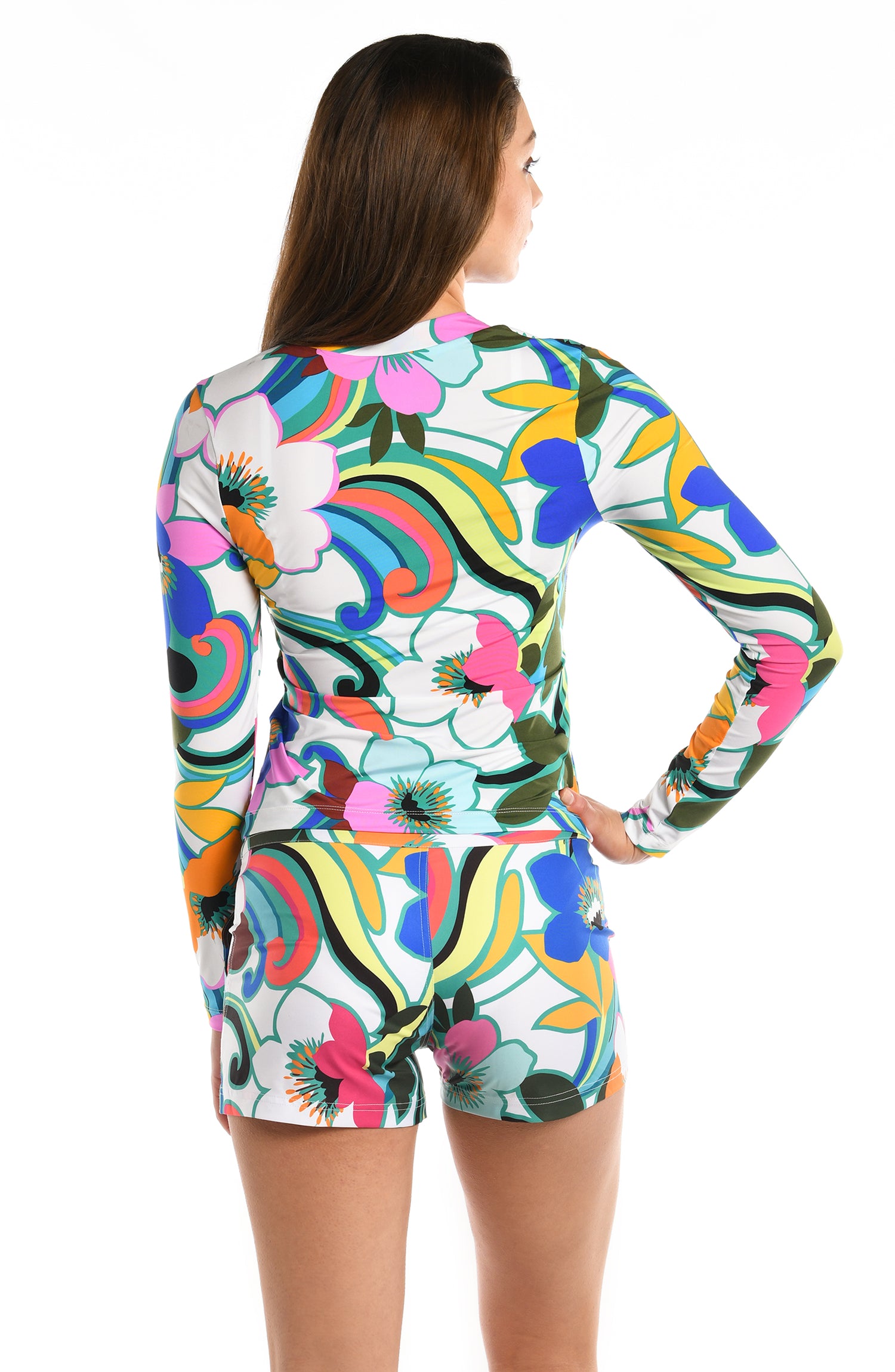 Model is wearing a multicolored bold floral printed half zip rashguard top from our Sun Catcher collection. 
