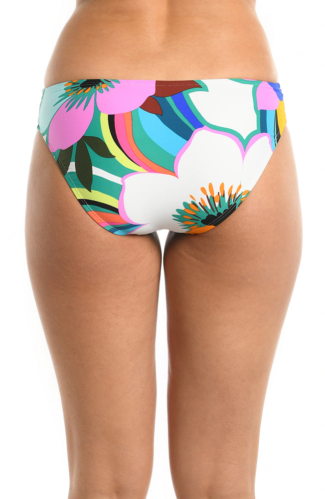 
            
                Load image into Gallery viewer, Model is wearing a multicolored bold floral printed hipster bikini bottom from our Sun Catcher collection. 
            
        