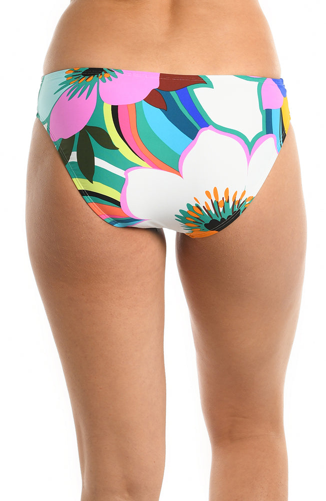 
            
                Load image into Gallery viewer, Model is wearing a multicolored bold floral printed hipster bikini bottom from our Sun Catcher collection. 
            
        