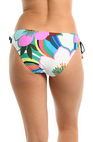 Model is wearing a multicolored bold floral printed side tie hipster bikini bottom from our Sun Catcher collection. 