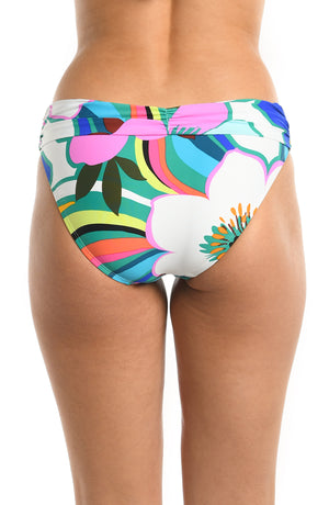 
            
                Load image into Gallery viewer, Model is wearing a multicolored bold floral printed shirred band hipster bikini bottom from our Sun Catcher collection. 
            
        