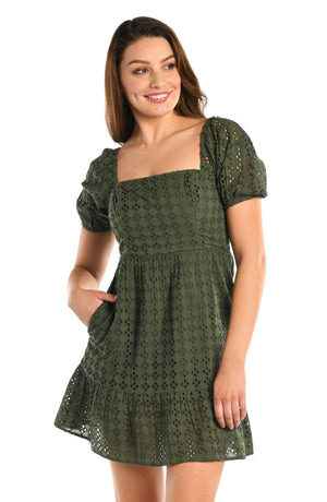 Model is wearing a forest green floral printed short sleeve cover up dress from our Saltwater Sands collection.