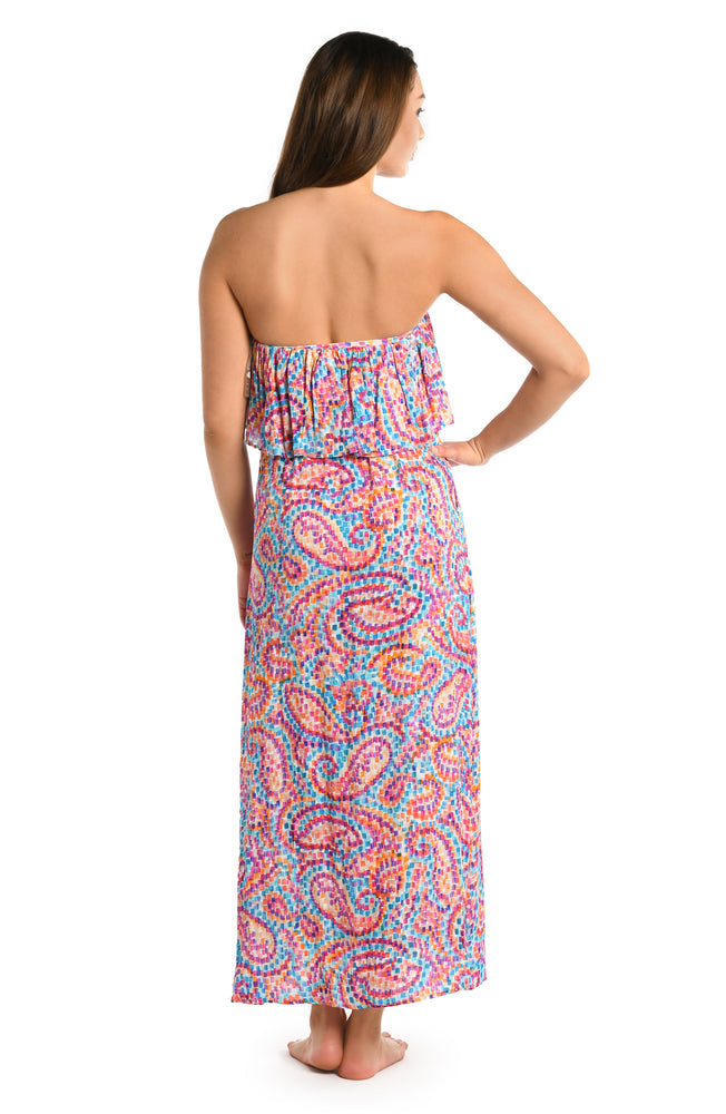 Model is wearing a pink multicolored paisley printed strapless midi dress cover up from our Pebble Beach collection.