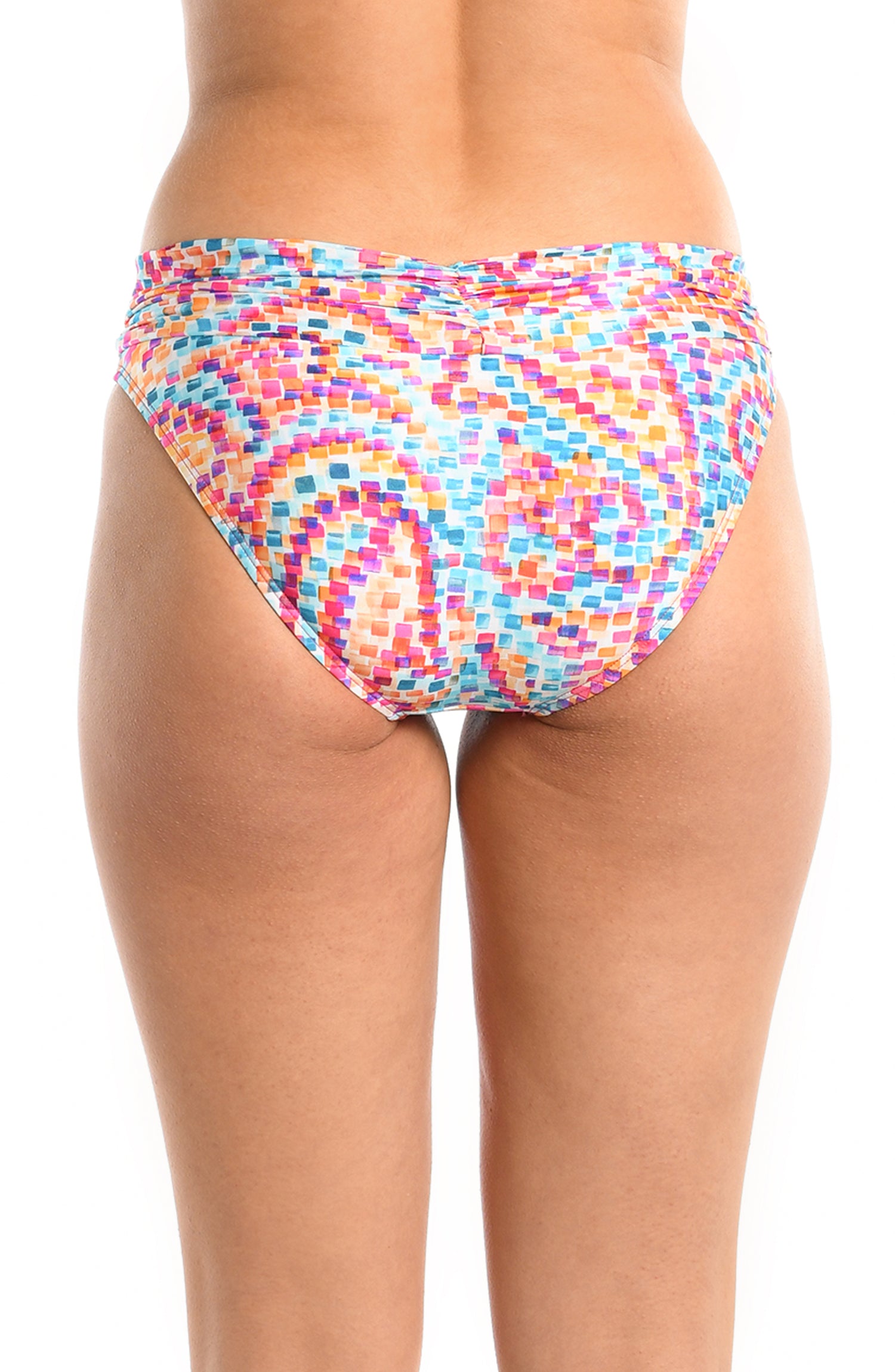 Model is wearing a pink multicolored paisley printed shirred band hipster bikini bottom from our Pebble Beach collection.
