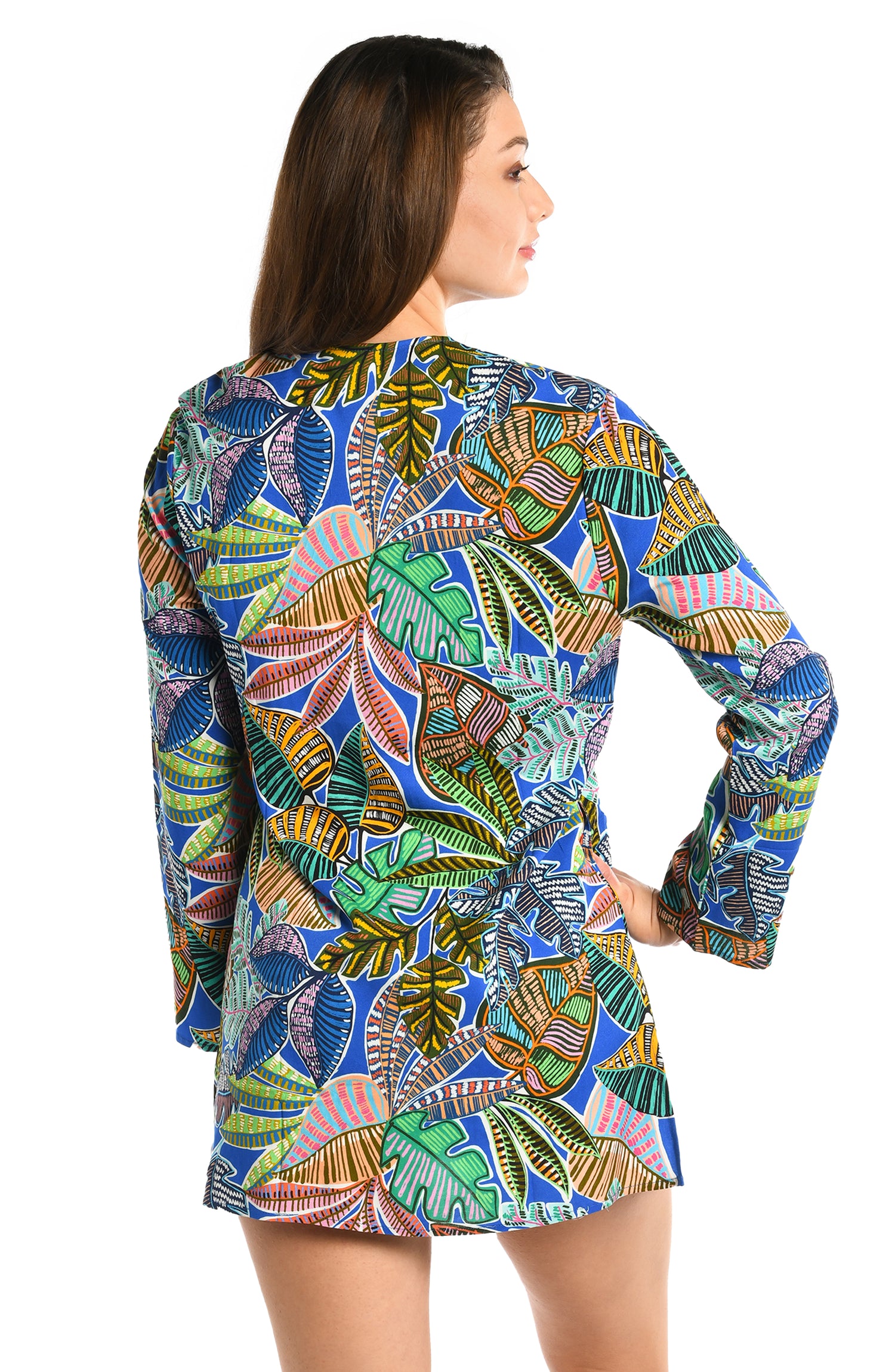 Model is wearing a neon colored printed tunic cover up from our Neon Nights collection!
