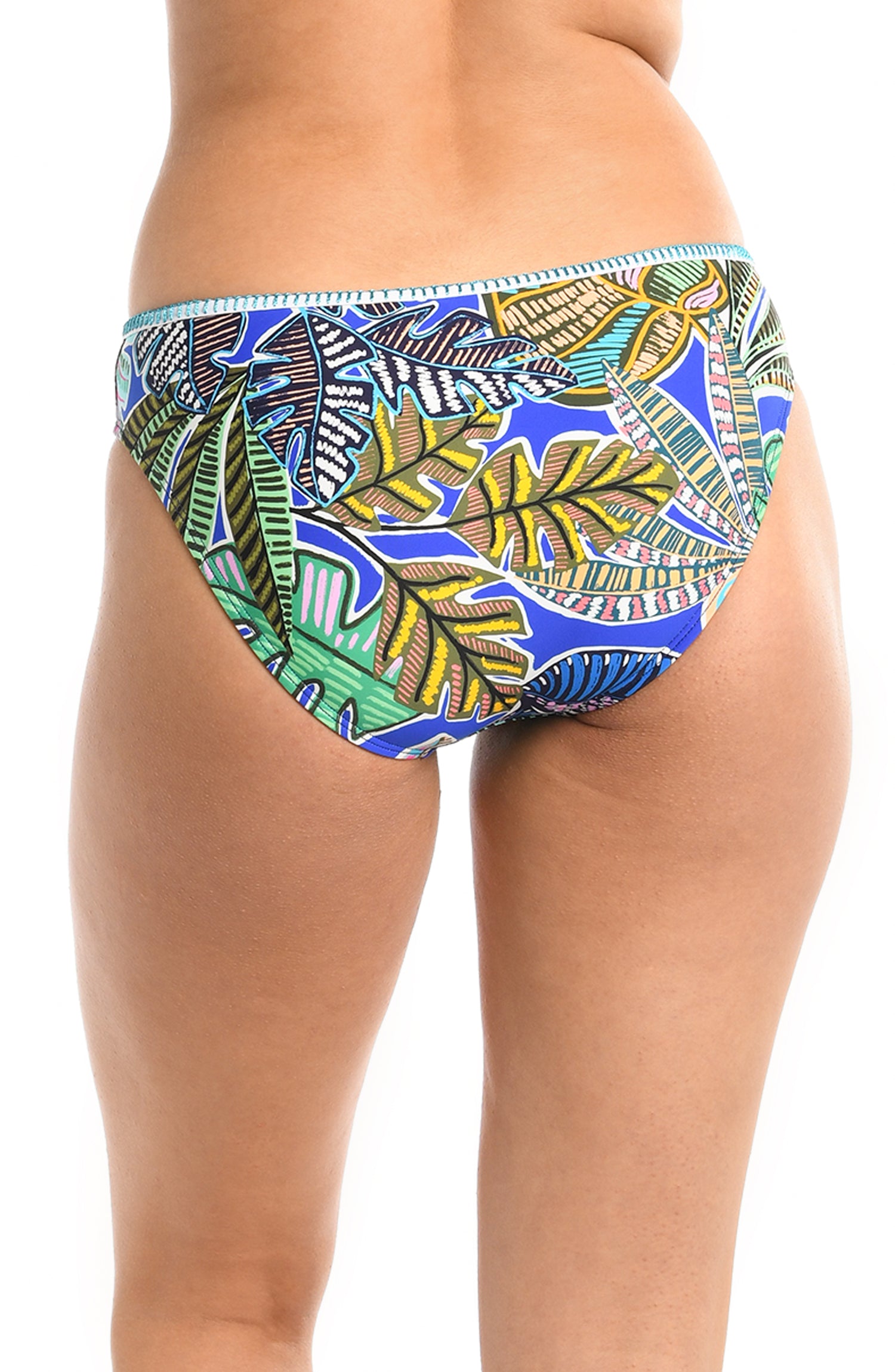 Model is wearing a neon colored tropical printed hipster bikini bottom from our Neon Nights collection.