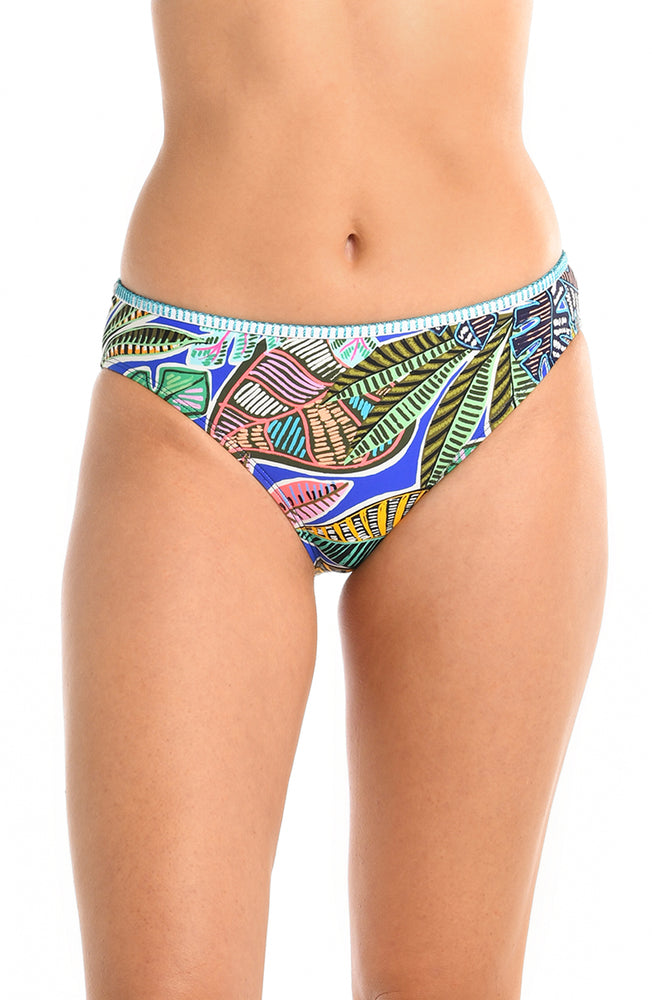 
            
                Load image into Gallery viewer, Model is wearing a neon colored tropical printed hipster bikini bottom from our Neon Nights collection.
            
        