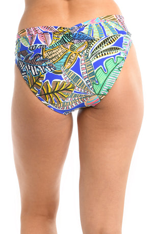 Model is wearing a neon colored tropical printed shirred band hipster bikini bottom from our Neon Nights collection.