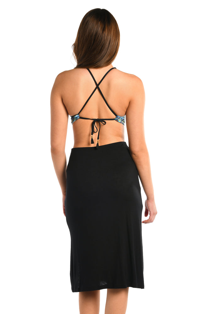 
            
                Load image into Gallery viewer, Model is wearing a black midi skirt swimsuit cover up from our Draped Darling collection.
            
        