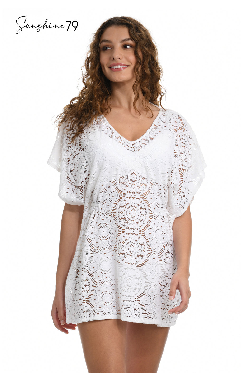 Model is wearing a white crochet v neck caftan cover up from our Sunshine 79 brand. 