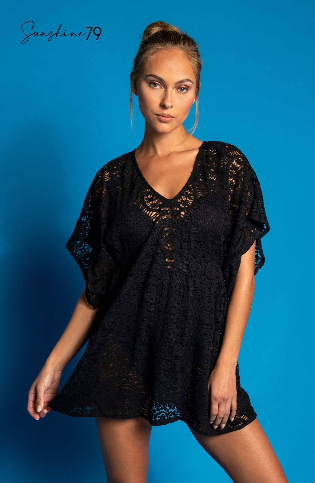 Model is wearing a black colored crochet tunic cover up from our Chillin Crochet collection!