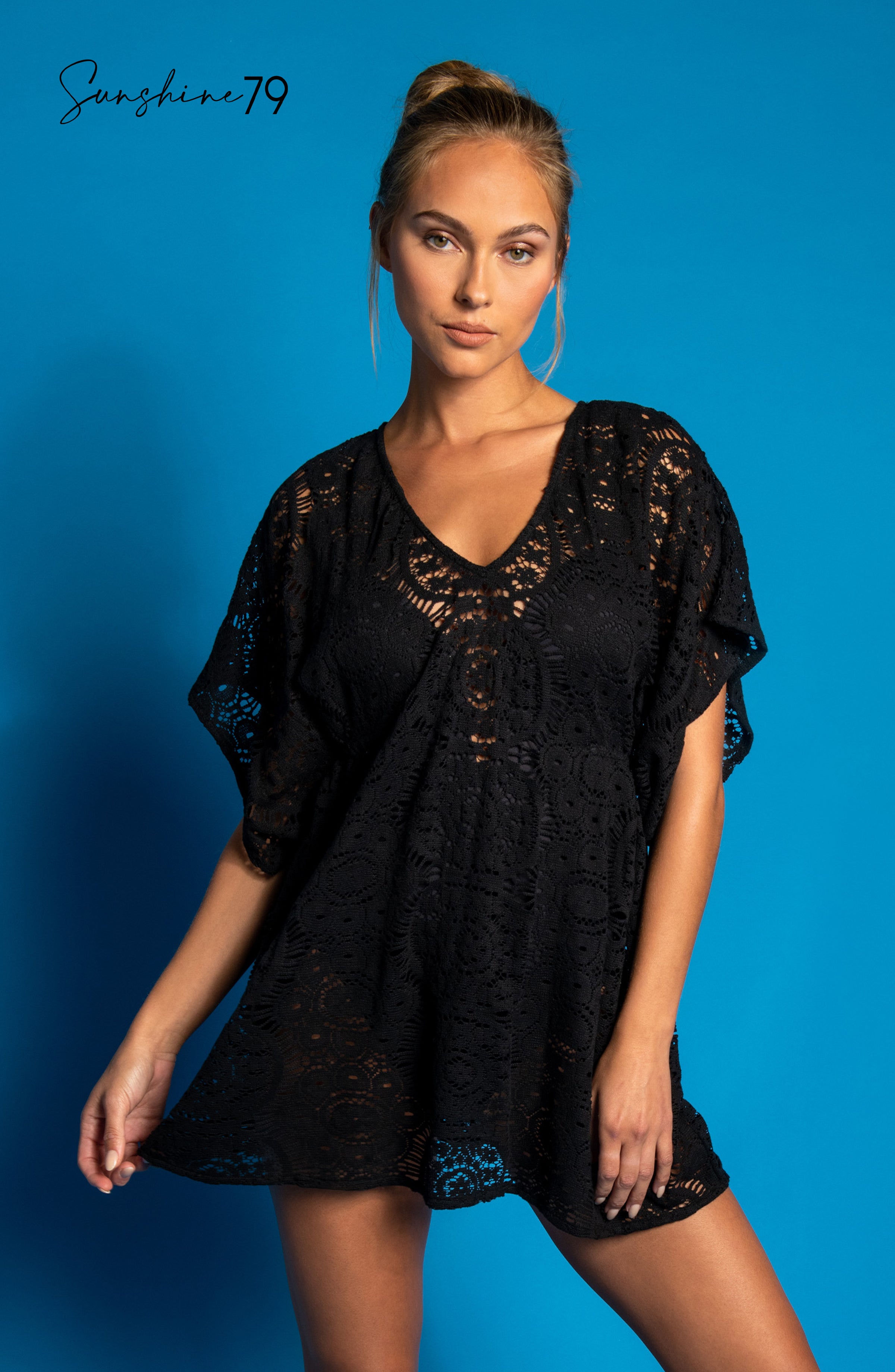 Model is wearing a black colored crochet tunic cover up from our Chillin Crochet collection!