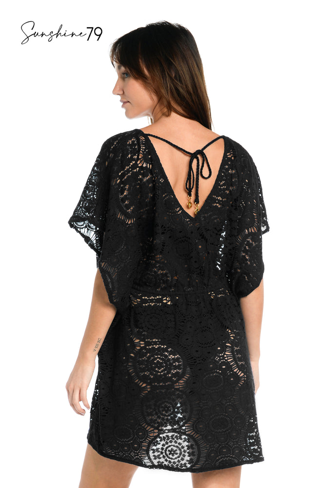 
            
                Load image into Gallery viewer, Model is wearing a black colored crochet tunic cover up from our Chillin Crochet collection!
            
        