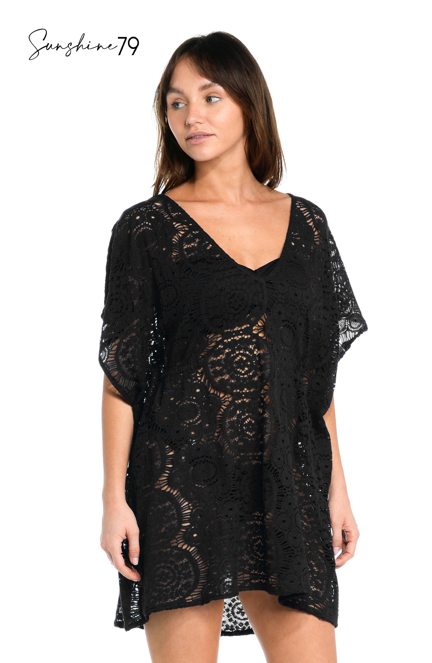 Model is wearing a black colored crochet tunic cover up from our Chillin Crochet collection!