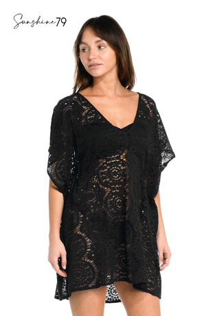 
            
                Load image into Gallery viewer, Model is wearing a black colored crochet tunic cover up from our Chillin Crochet collection!
            
        