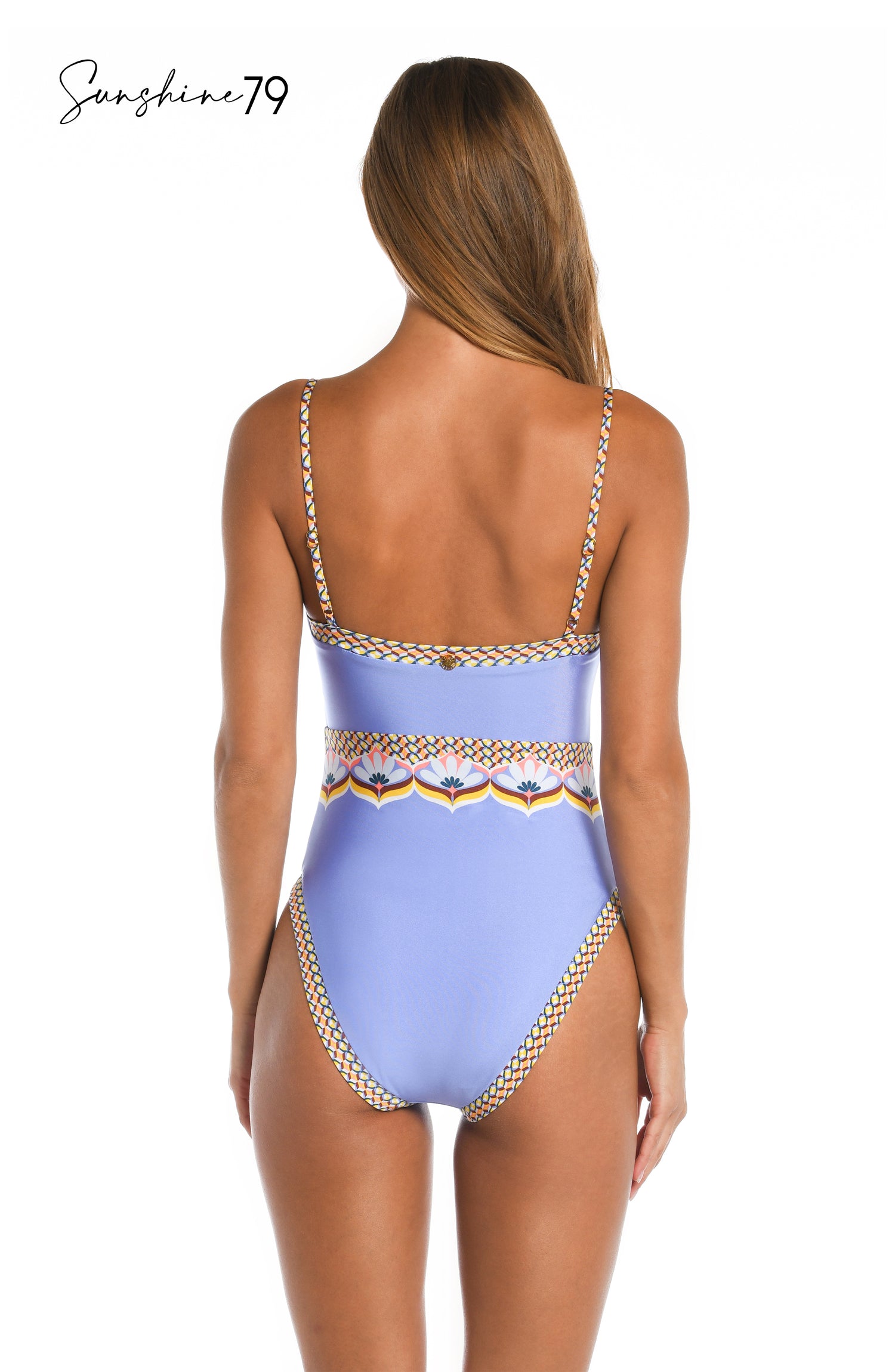 Model is wearing a light purple geometric printed over the shoulder one piece from our Sunshine 79 brand.