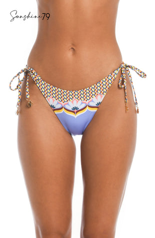 Model is wearing a light purple geometric printed string tie side hipster bikini bottom from our Sunshine 79 brand.