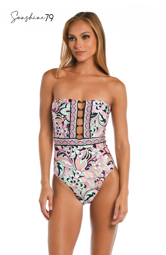 Model is wearing a pink multicolored paisley printed keyhole bandeau one piece from our Sunshine 79 brand.