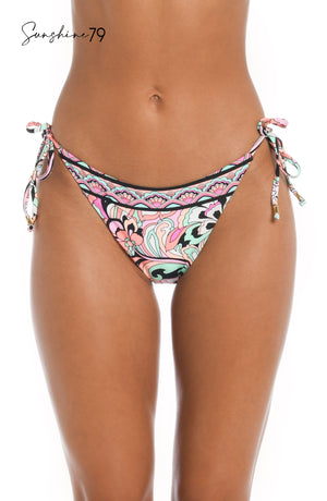 
            
                Load image into Gallery viewer, Model is wearing a pink multicolored paisley printed string tie side hipster bikini bottom from our Sunshine 79 brand.
            
        