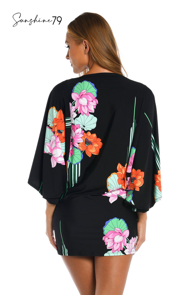 Model is wearing a black multi colored tropical printed tunic cover up from our Mystic Lotus collection!