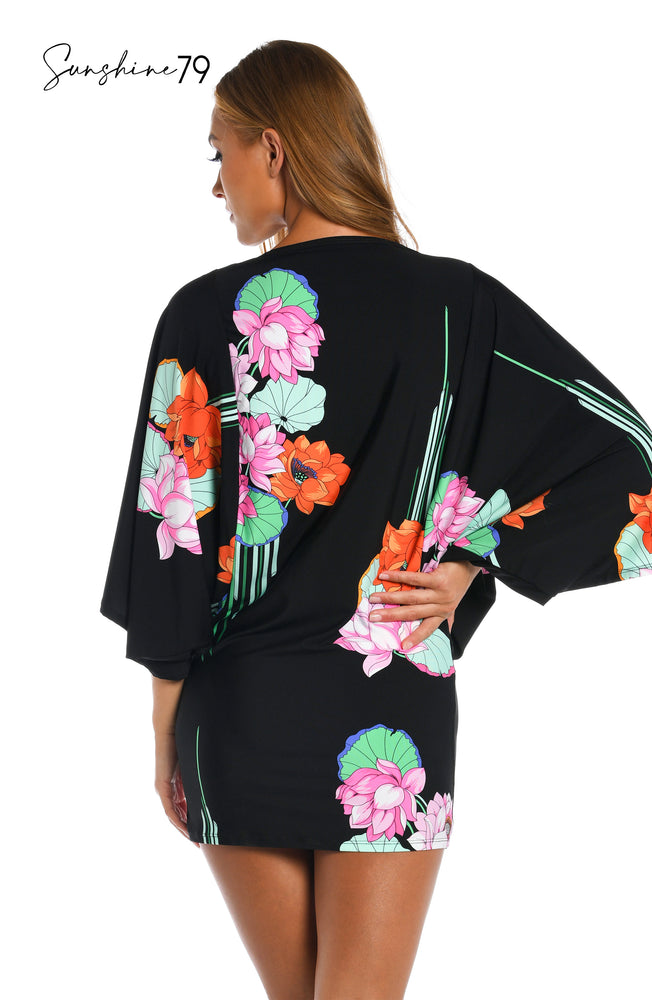 Model is wearing a black multi colored tropical printed tunic cover up from our Mystic Lotus collection!